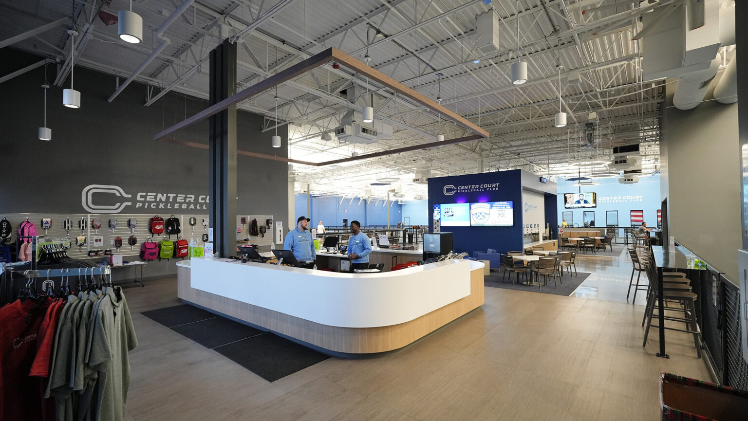 The bright member lounge and front desk at Center Court Gilbert