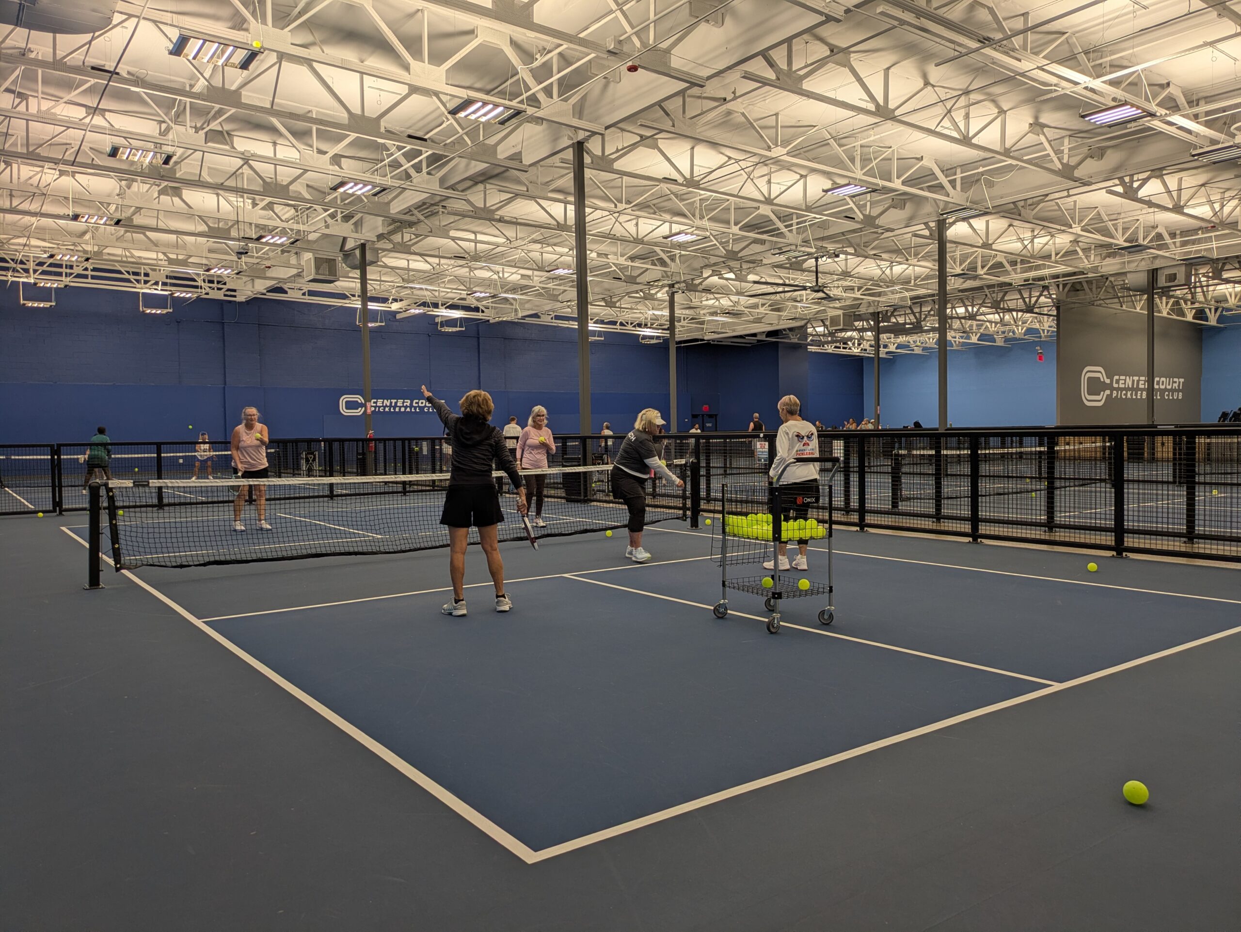 Kyle Chittenden and Lesli Link conducting a pickleball clinic at Center Court Glendale