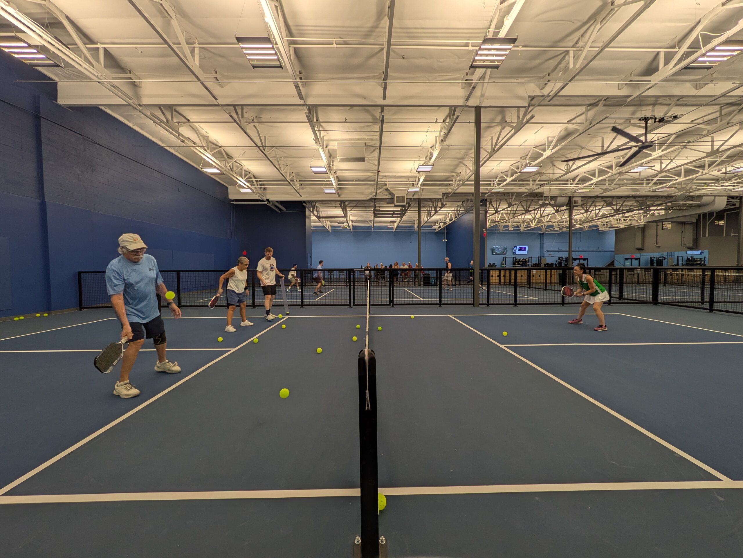 Players tapping paddles after a match at Center Court
